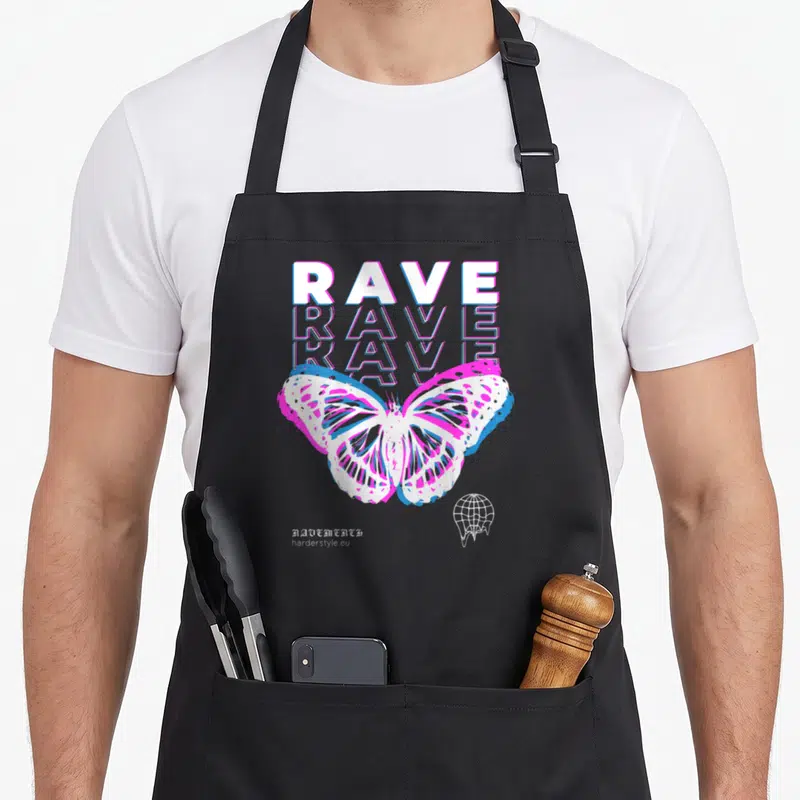 Tablier de cuisine noir avec un grand papillon blanc aux contours magenta et cyan, surmonté du texte RAVE en lettres blanches et roses.