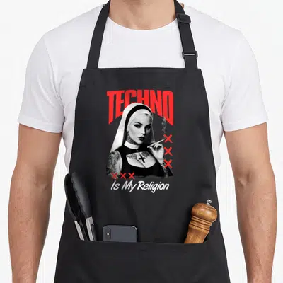 Tablier de cuisine noir avec une nonne tattooée fumant et le texte TECHNO Is My Religion en rouge et blanc.