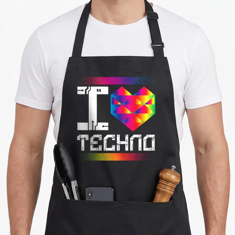 Tablier de cuisine noir avec inscription I Love Techno en blanc circuit imprimé et cœur géométrique multicolore.