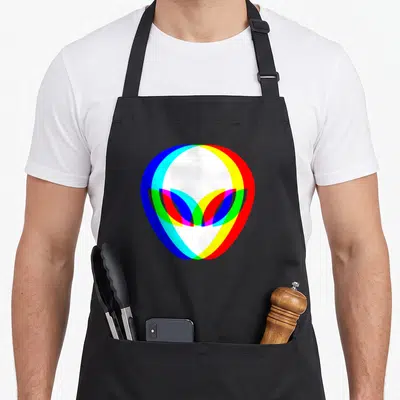 Tablier de cuisine noir avec tête d'alien aux contours multicolores style glitch et effet chromatic aberration.