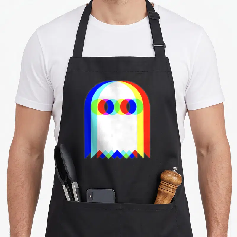 Tablier de cuisine noir avec un motif fantôme géométrique aux couleurs vives et arches superposées.
