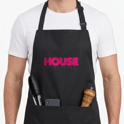 Tablier de cuisine noir avec linscription HOUSE en rose vif texturé et MUSIC en dessous.