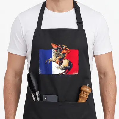 Tablier de cuisine noir avec illustration de Bonaparte sur cheval devant un drapeau français et le mot FRANCE.