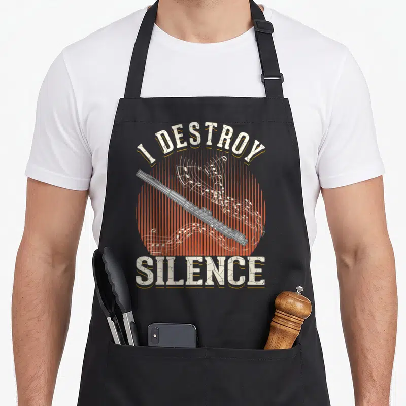 Tablier de cuisine noir avec une illustration de flûte traversière et le texte I destroy silence en typographie vintage.