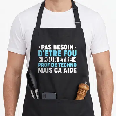 Tablier de cuisine noir avec inscription typographique blanche et bleue sur fond gris uni.