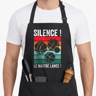 Tablier de cuisine noir avec inscription Silence Le Maître Lance Boccia et illustrations de boccias sur bandes colorées vintage.