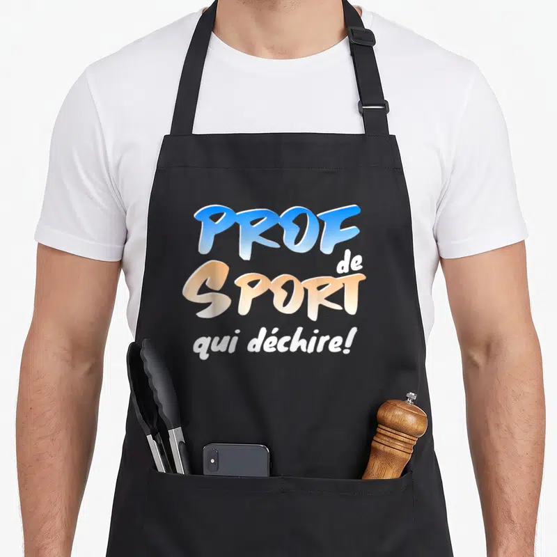 Tablier de cuisine noir avec inscription Prof de sport qui déchire en lettres bleues et oranges.