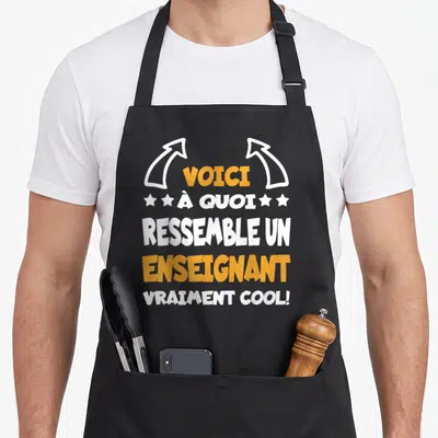 Tablier de cuisine noir avec inscription Voici à quoi ressemble un enseignant vraiment cool en orange et blanc.