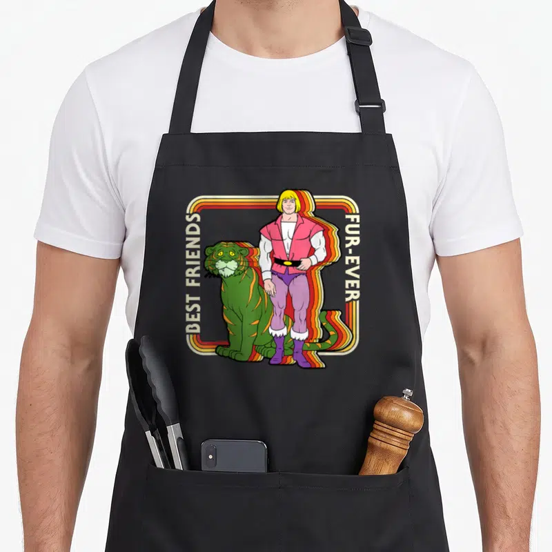 Tablier de cuisine noir avec illustration d'He-Man, Tiger Shriek et texte BEST FRIENDS FUR-EVER en cadre arc-en-ciel.