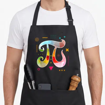 Tablier de cuisine noir avec un grand symbole Pi décoré de triangles colorés et de formes géométriques dispersées autour.