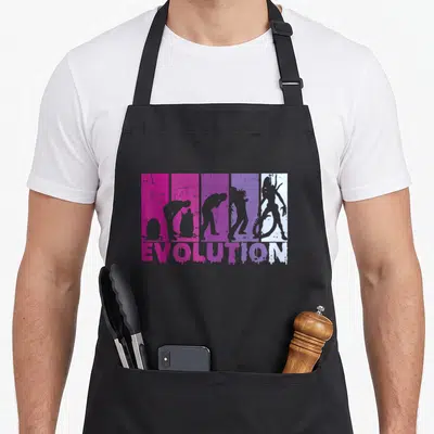 Tablier de cuisine noir avec illustration Evolution rétro Alien extraterrestre en dégradé rose et violet.