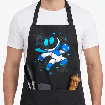 Tablier de cuisine noir avec Astro Bot bleu blanc combattant des ennemis gris dans l'espace entouré d'étoiles scintillantes.