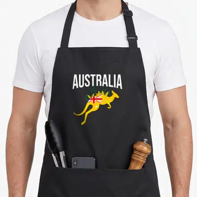 Tablier de cuisine noir avec un kangourou jaune et le mot Australia imprimé en blanc.