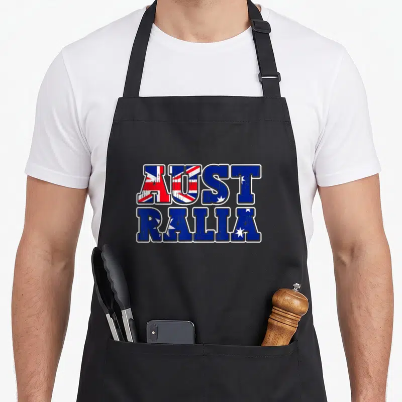 Tablier de cuisine noir avec le mot Australia en lettres remplies du drapeau australien et effets de vieillissement.