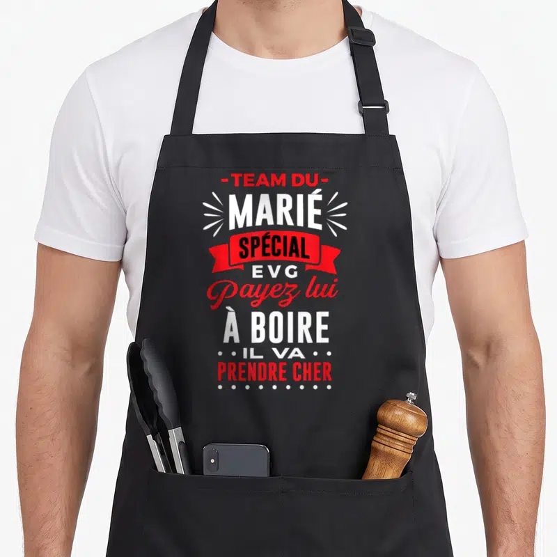 Tablier de cuisine noir avec inscription Team du Marié Spécial EVG Payez lui à boire Il va prendre cher en rouge et blanc.