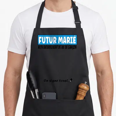 Tablier de cuisine noir avec inscription Futur Marié Mon enterrement de vie de garçon et On signe tous en bas.