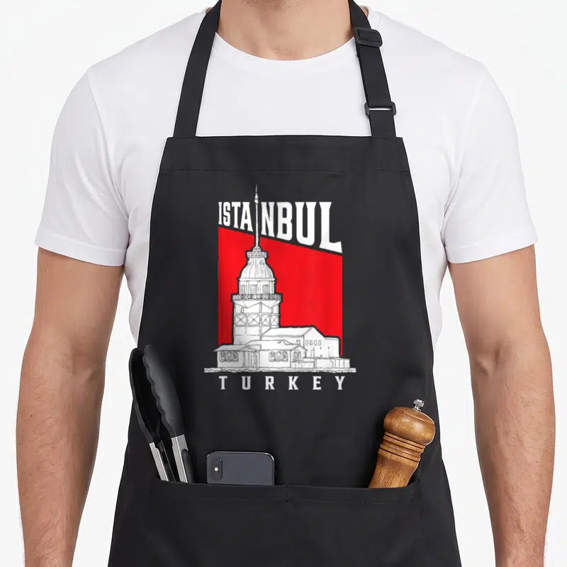 Tablier de cuisine noir avec illustration blanche de la Tour de Jeune Fille sur fond rouge et texte Istanbul Turkey.