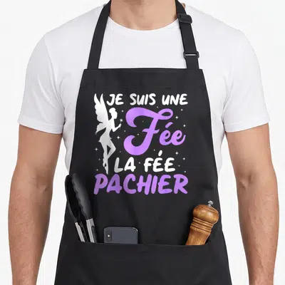 Tablier de cuisine noir avec une fée blanche et le texte Je Suis Une Fée La Fée Pachier en violet.