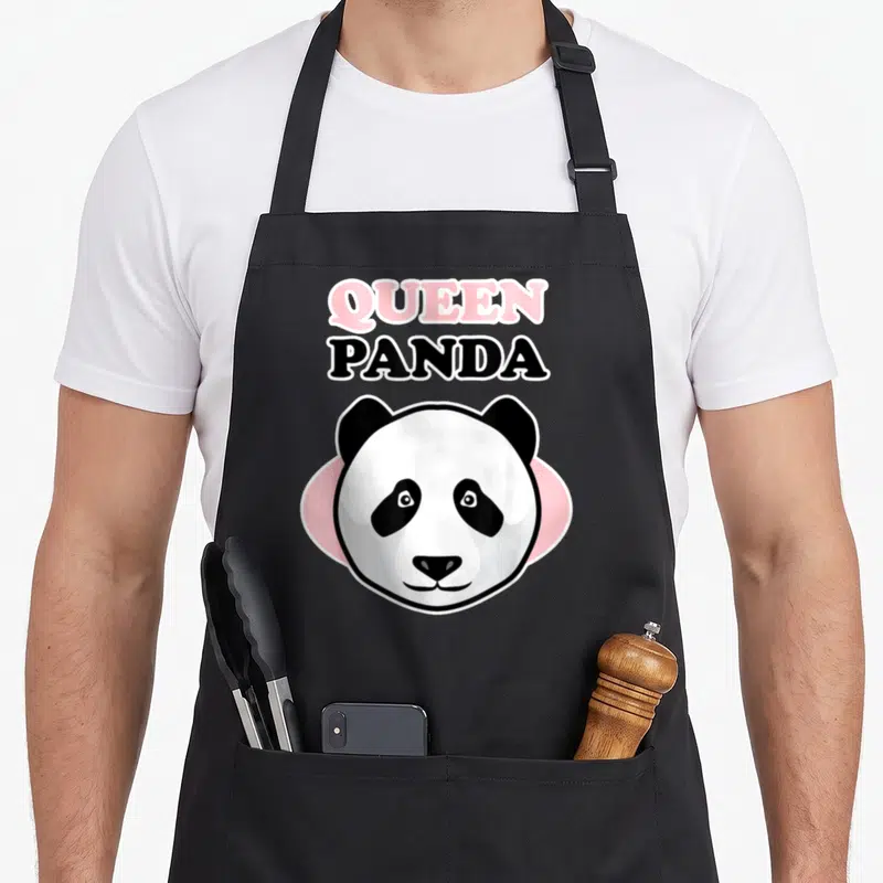 Tablier de cuisine noir avec tête de panda et texte Queen Panda en rose et noir.