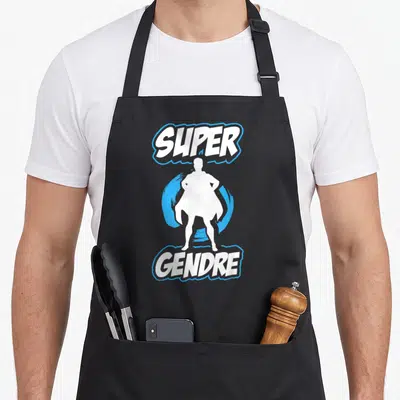 Tablier de cuisine noir avec silhouette de super-héros blanche et texte Super Gendre en blanc et bleu.