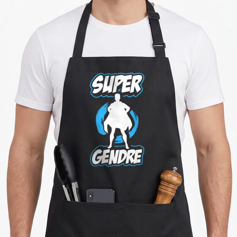 Tablier de cuisine noir avec silhouette de super-héros blanche et texte Super Gendre en blanc et bleu.