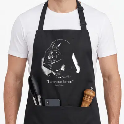 Tablier de cuisine noir avec portrait blanc de Darth Vader et la citation I am your father en bas du motif imprimé.