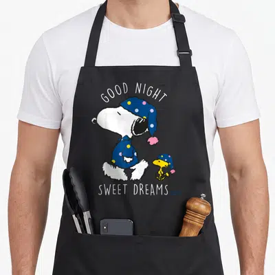 Tablier de cuisine noir avec Snoopy et Woodstock en bonnets bleus à pois et texte Good Night Sweet Dreams.