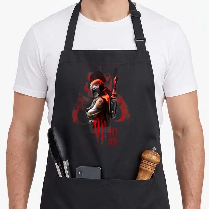 Tablier de cuisine noir avec illustration stylisée de Boba Fett et texte Hunter Box en rouge.