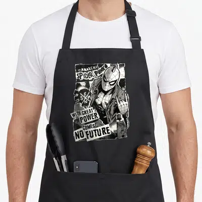 Tablier de cuisine noir avec illustration monochrome du Spider-Punk et texte anarchique.