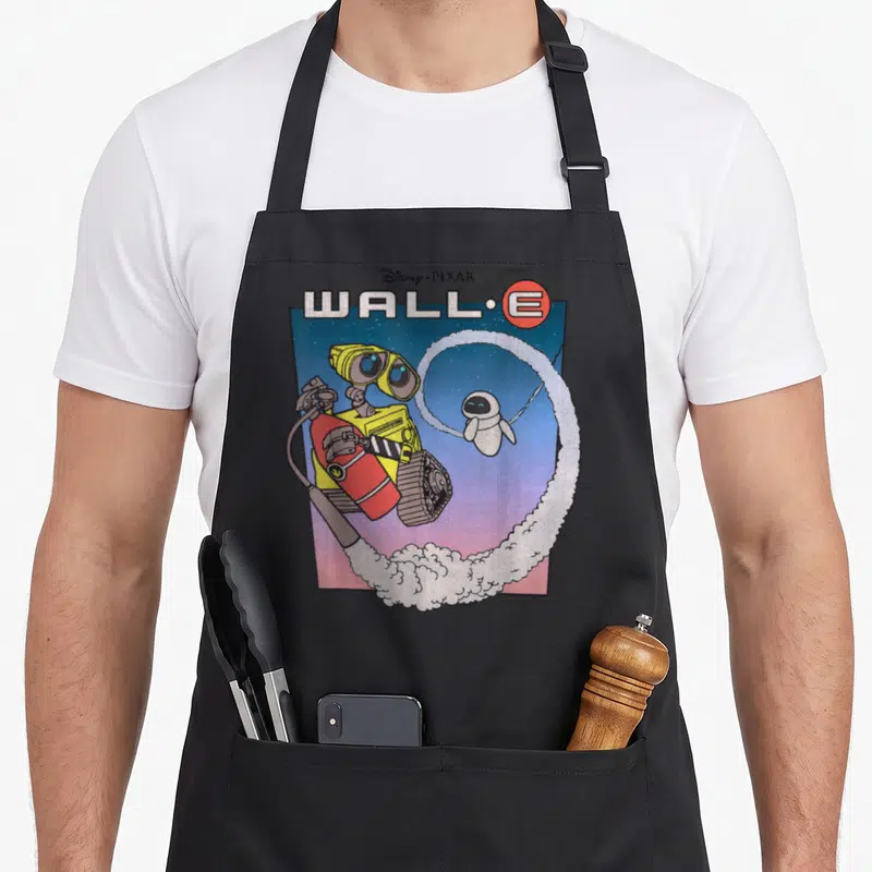 Tablier de cuisine noir avec illustration WALL-E Fly Eve style poster vintage aux couleurs vives.