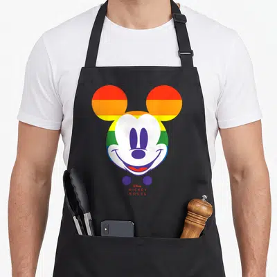 Tablier de cuisine noir avec tête de Mickey aux oreilles arc-en-ciel et texte Disney Mickey Mouse en rouge