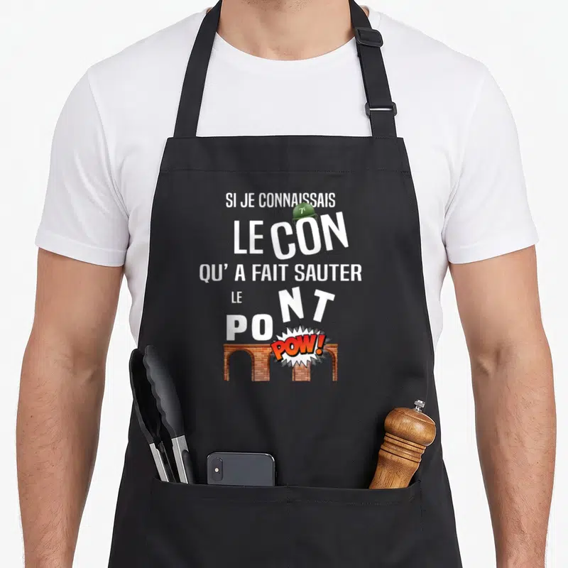 Tablier de cuisine noir avec l'inscription Si je connaissais le con qu'a fait sauter le pont au-dessus d'un pont en brique.