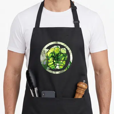 Tablier de cuisine noir avec un poing du Hulk vert en style comics dans un cercle gris
