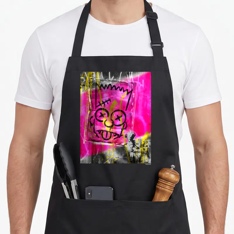 Tablier de cuisine noir avec un portrait graffiti rose d'El Barto aux yeux en croix et coulures jaunes.