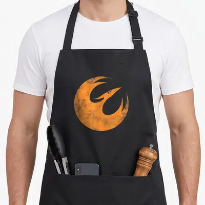 Tablier de cuisine noir avec l'emblème orange du Phoenix de Star Wars Rebels au centre.