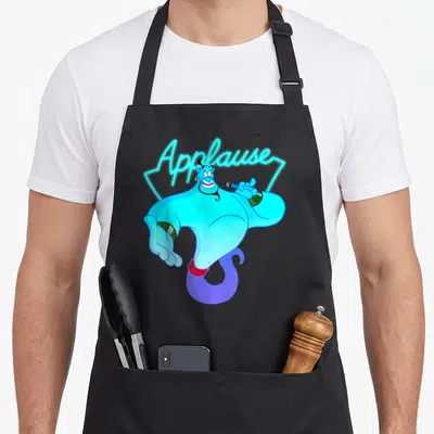 Tablier de cuisine noir avec le Genie d'Aladdin tenant un micro et le texte Applause en lettres néon bleues au-dessus.