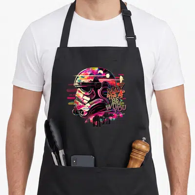 Tablier de cuisine noir avec illustration synthwave d'un Stormtrooper et les silhouettes d'AT-AT en bas à droite.