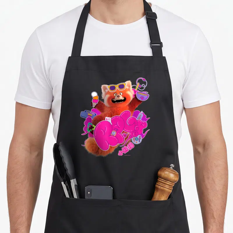 Tablier de cuisine noir avec un red panda rose portant des lunettes et le mot RPG en lettres roses.