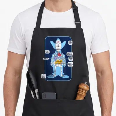 Tablier de cuisine noir avec illustration radiographique de Krusty le clown montrant son squelette et ses burgers internes.