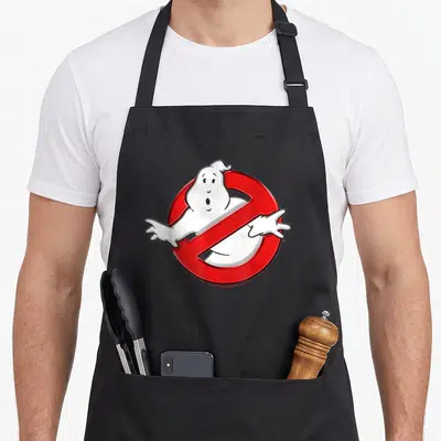 Tablier de cuisine noir avec le logo d'un fantôme blanc barré d'une ligne rouge diagonale.