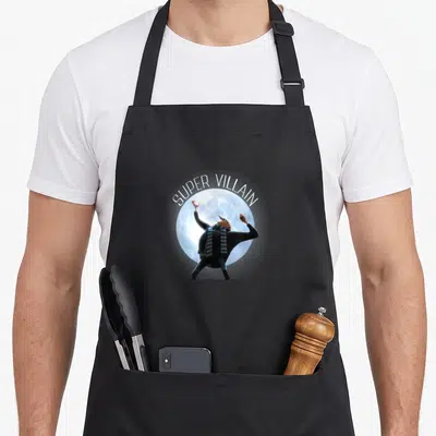 Tablier de cuisine noir avec Gru en Super Villain posant devant une pleine lune bleue.