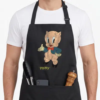 Tablier de cuisine noir avec Porky Distressed en costume bleu et nœud papillon rouge, style vintage dégradé.