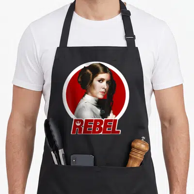 Tablier de cuisine noir avec portrait Princess Leia REBEL Badge fond rouge inscription blanche et rouge