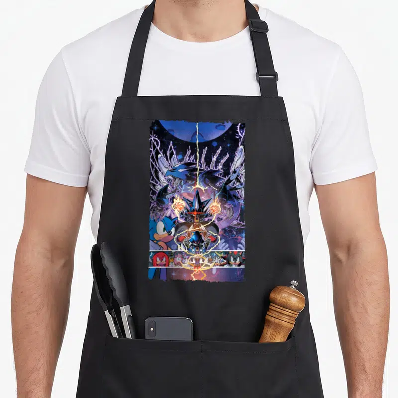 Tablier de cuisine noir avec une illustration colorée de Sonic The Hedgehog et des créatures spatiales sur fond d'univers stellaire.