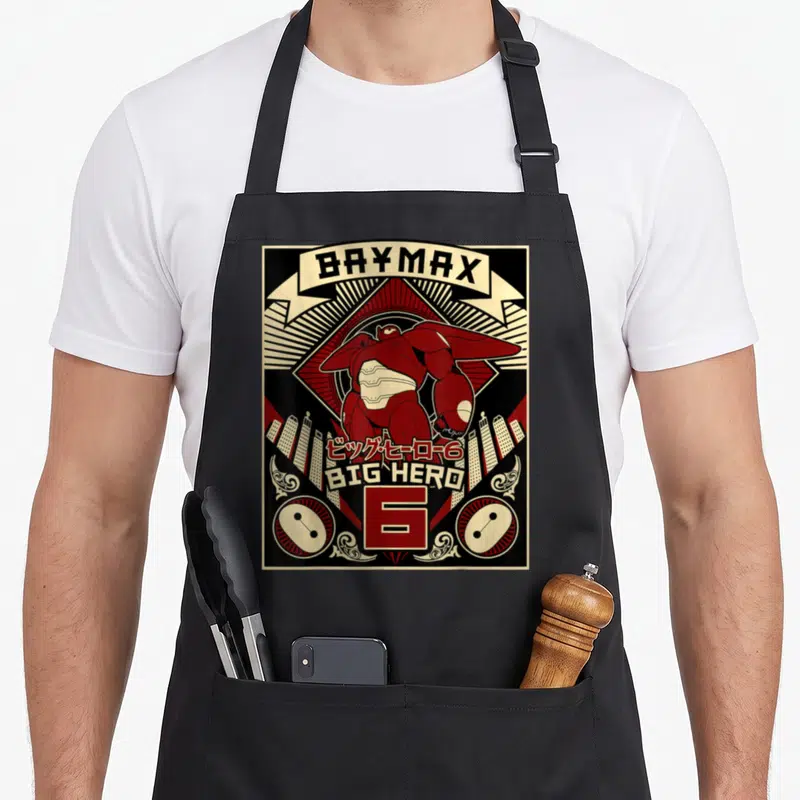 Tablier de cuisine noir avec illustration style affiche propaganda du robot Baymax en rouge et noir.