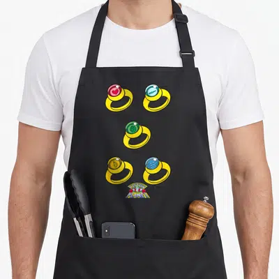 Tablier de cuisine noir avec cinq anneaux dorés colorés et le logo Captain Planet en bas.