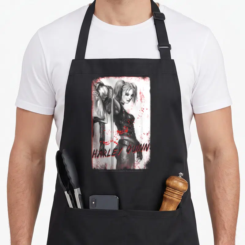 Tablier de cuisine noir avec illustration Harley Quinn et texte rouge style graffiti