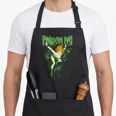 Tablier de cuisine noir avec illustration de Poison Ivy aux cheveux orange entourée de lierre vert et du texte Poison Ivy en haut.