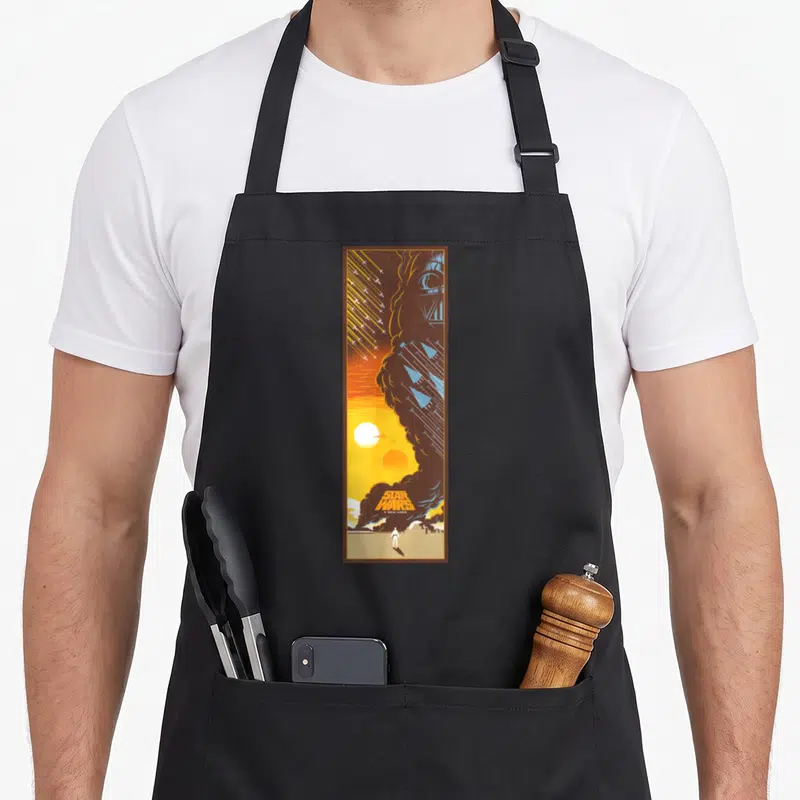 Tablier de cuisine noir avec affiche Star Wars Un nouvel espoir et silhouette Darth Vader orange bleue