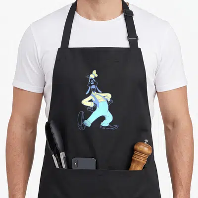 Tablier de cuisine noir avec illustration néon de Goofy marchant joyeusement en chemise jaune et bretelles bleues.